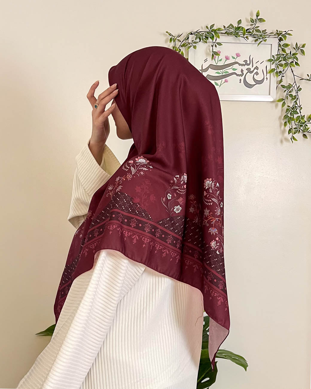 Side profile view showcasing the graceful drape and timeless versatility of the Khamrat Al Ward luxury maroon headscarf for formal wear.